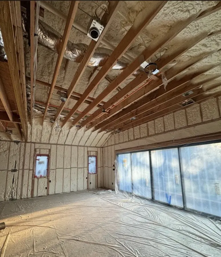 Interior walls and ceiling insulated with spray foam during new construction in Nibley
